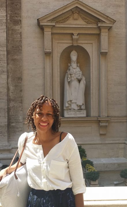 Woman standing in front of a statue