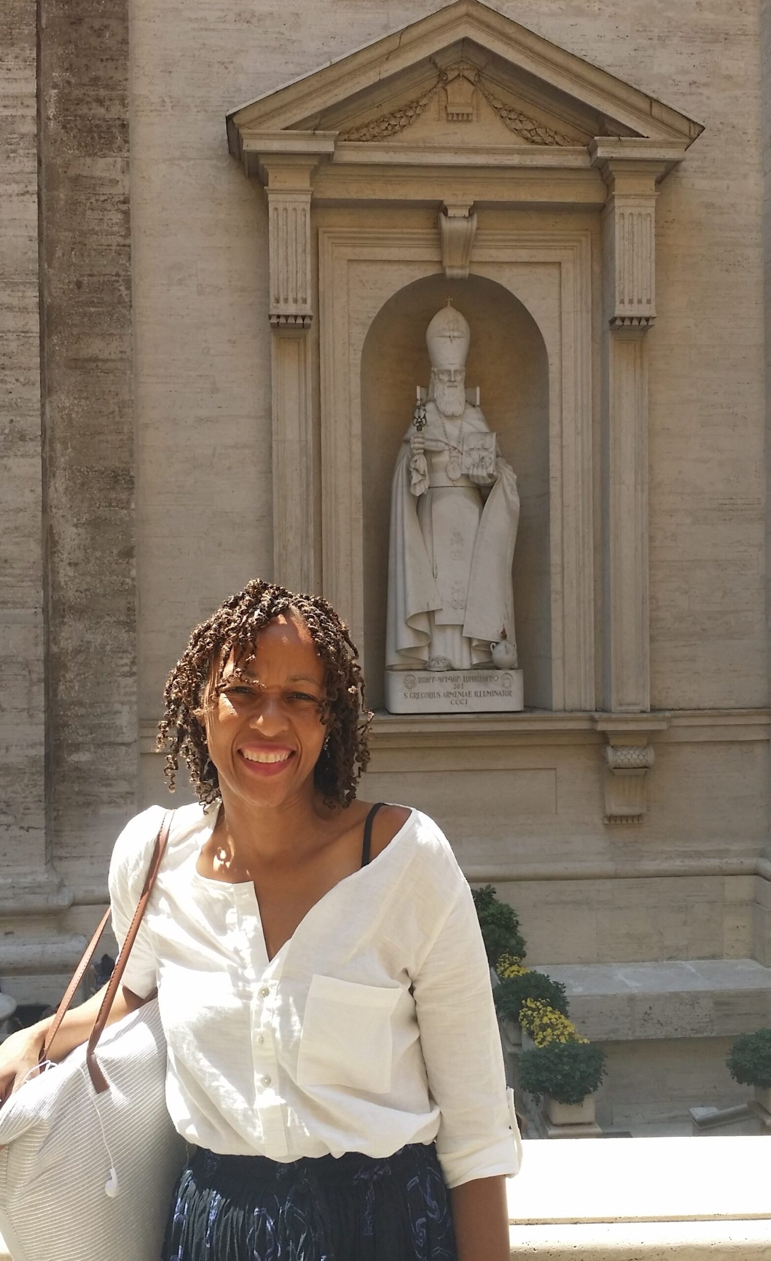 Woman standing in front of a statue