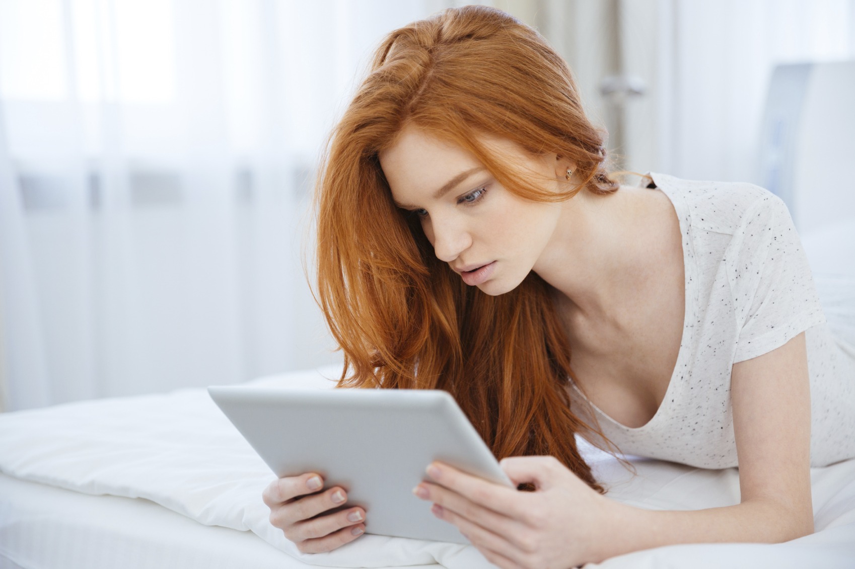 Woman reading on her tablet