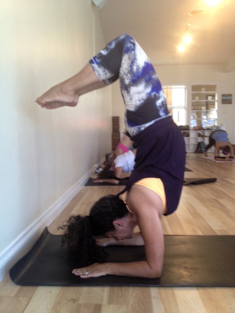 Woman doing a forearm balance upside down