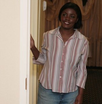 A woman leaning into her doorway