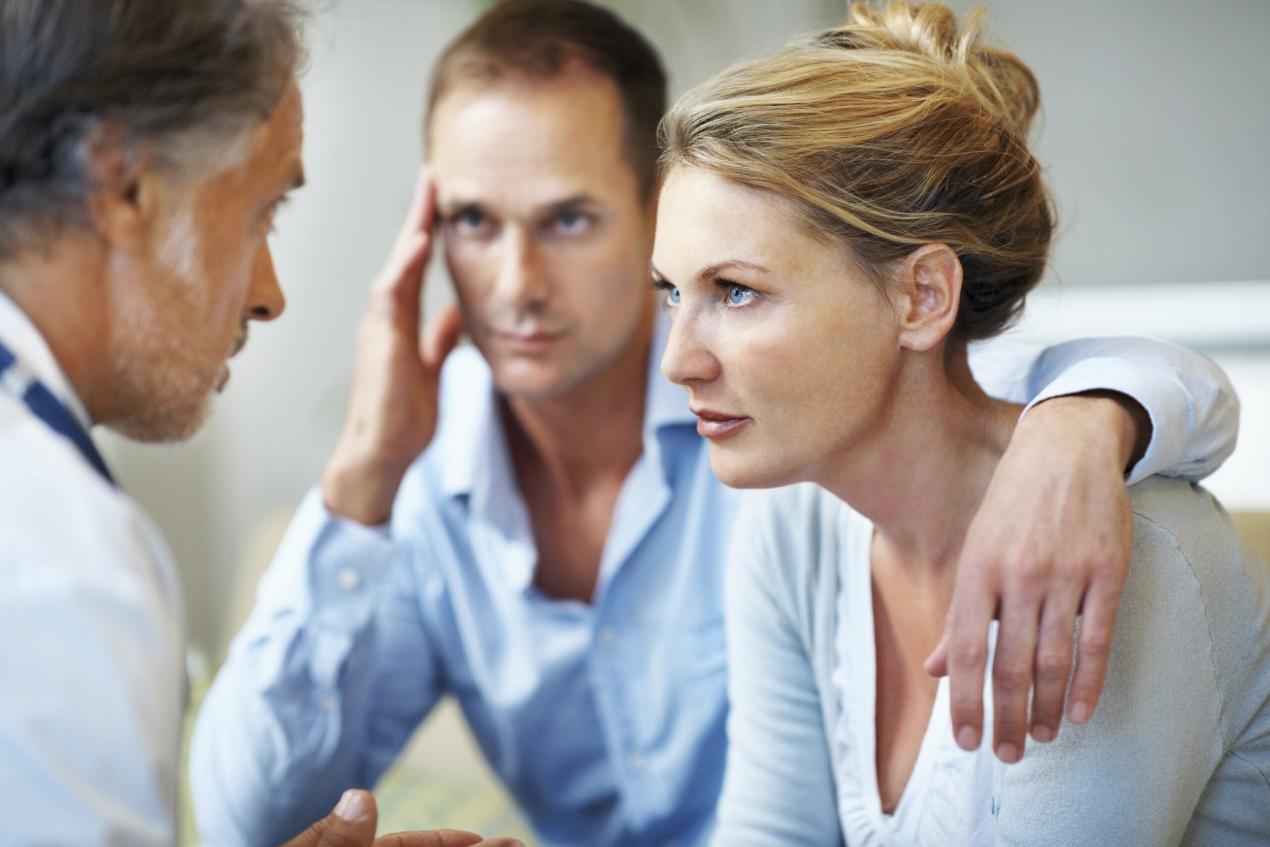 A couple having a serious talk with their doctor